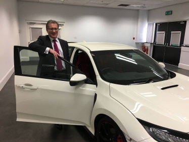 Rugby MP Mark Pawsey with a Honda Civic built at their factory in Swindon