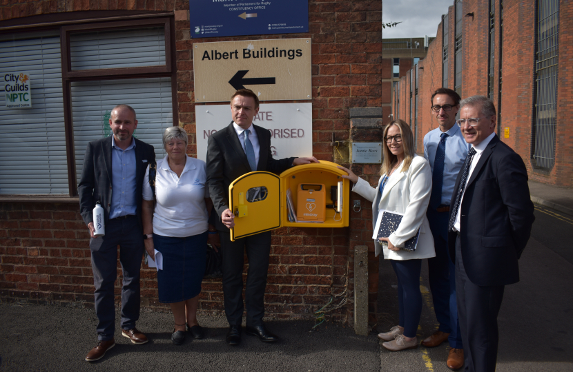 LR: Cllr Simon Ward; Karen Herrington; Will Quince MP, Minister of State for Health and Secondary Care; Naomi Issitt; Cllr Yousef Dahmash and Mark Pawsey MP with the OurJay Defibrillator installed at Mark’s constituency office
