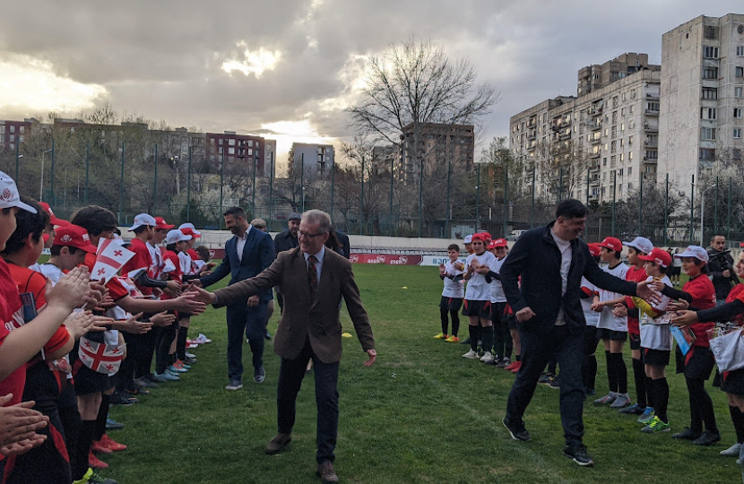 Rugby MP Mark Pawsey and Chairman of the Georgian Rugby Board Davit Kacharava with junior players at the Lelo Saracens ground in Tbilisi, Georgia 
