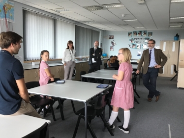 Rugby MP Mark Pawsey observes a socially distanced lesson by Mr Payne at Rugby Free Primary.jpeg